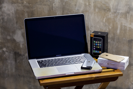 CHIANGMAI , THAILAND - MAR 28 2017: Macbook Pro computers and iPhone on table.のeditorial素材