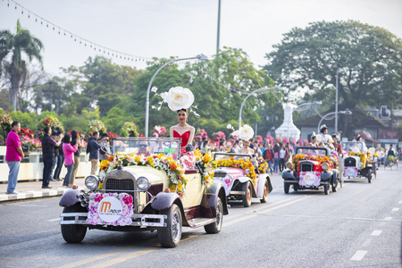 CHIANGMAI , THAILAND - FEB 2 2019: Young men and young women in costume taking part in an annual flower festival, 43 th Anniversary Chiang Mai Flower Festival 2019.のeditorial素材