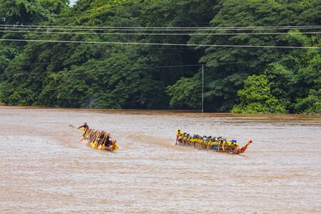 PHICHIT, THAILAND - SEP 8 2019: Thai Traditional Long Boat Racing 2019 At Nan River in front of Tha Luang Temple Phichit Thailandのeditorial素材