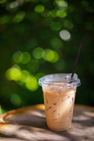 Iced latte coffee on the wood tableの写真素材