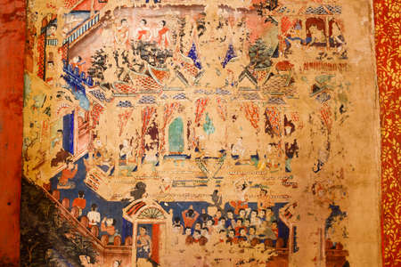 Wall Ancient painting of buddhist temple mural at Wat Phra sing, a famous temple in chiangmai province, Thailand. The temple is open to the public and has beautiful murals on the walls.のeditorial素材