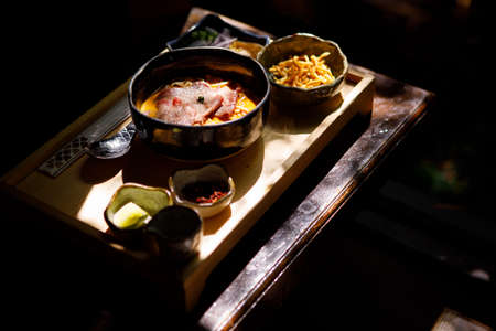 Curried Noodle Soup (Khao soi) with thai style spice, Northern Thai style cuisine.