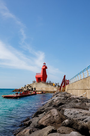 Wonderful Iho Tewoo Beach two horse shaped lighthouses. Jeju Island, South Koreaの写真素材