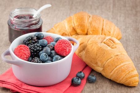 Mixed berry jam with bilberries, raspberries and blackberries on the tableの写真素材