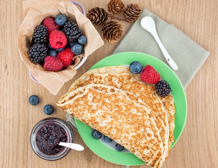 Delicious pancakes with jam and fruit