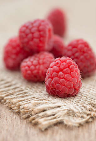 Fresh raspberry on wooden tableの写真素材