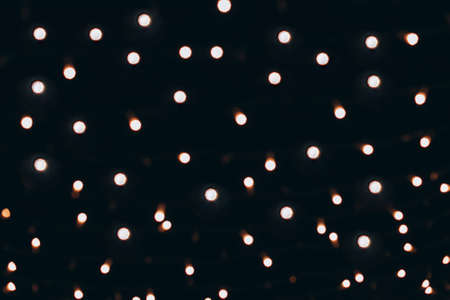 Night city lights blurred bokeh, defocused background.の写真素材