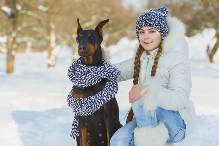 joyful children playing in snow. Two happy girls having fun outside winter dayの写真素材