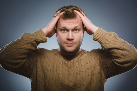 Closeup Scared and shocked man. Human emotion face expressionの写真素材