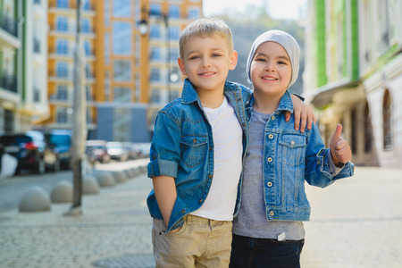 Cute Little Boys outdoors in city on beautiful spring dayの写真素材
