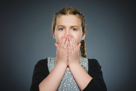 Closeup Scared and shocked little girl. Human emotion face expressionの写真素材