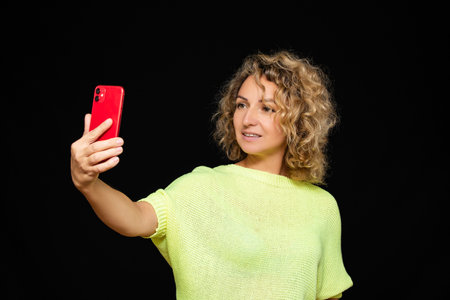 Girl with phone selfie beautiful calls close up