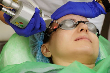 cosmetology, laser resurfacing, facial cleansing in the beautician's office, in a beauty salon, a...