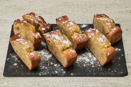 Apple cake made from fresh apples sprinkled with powdered sugarの写真素材