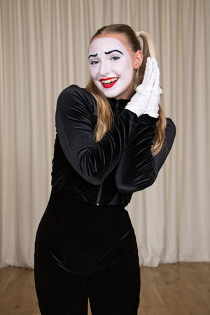 Close-up portrait of a mime girl with a sweet smile.の写真素材