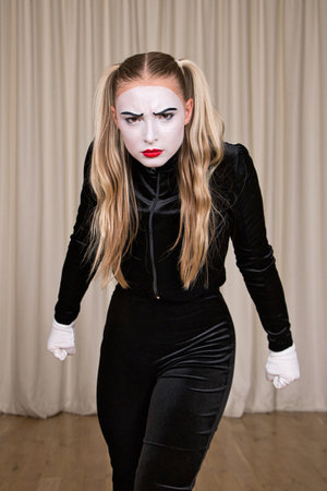 Close-up portrait of a mime girl expressing display.の写真素材