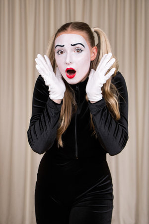 Close-up portrait of a mime girl expressing surprise.の写真素材