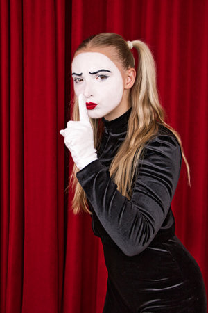 The focus is on a mime artist making signs.の写真素材