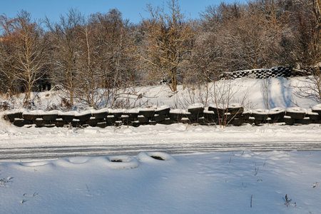 A barrier made from car tires for sports car racing on ice.