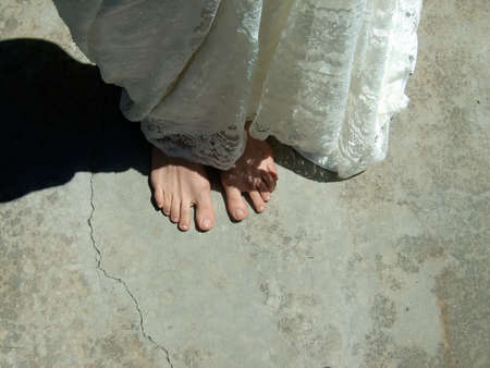 Woman bare feet with a dressの写真素材