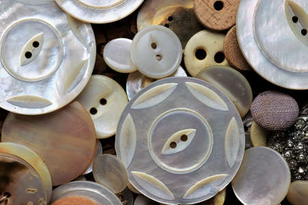 Assortment of vintage clothing buttons of different sizesの写真素材