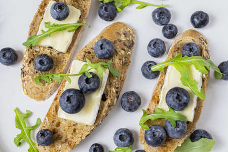 baguette with brie and blueberriesの写真素材