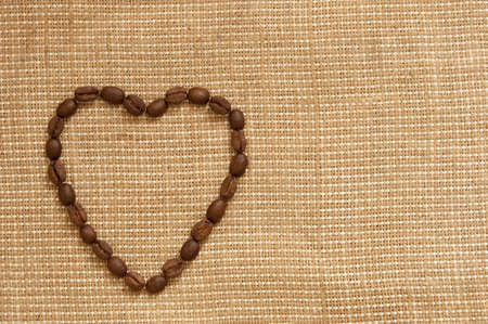 Love symbol made of coffee beansの写真素材