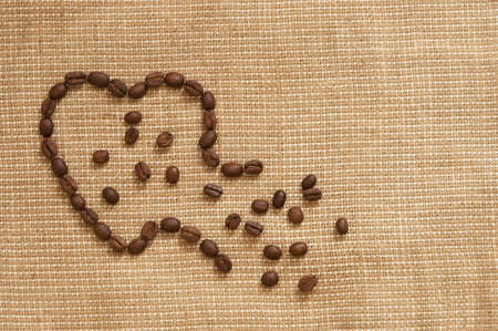 Love symbol made of coffee beans rupturedの写真素材