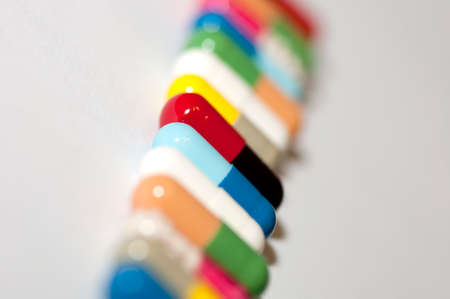 Assortment of capsules in row close up