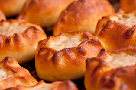 Hot pasties  patties  on baking tray close upの写真素材