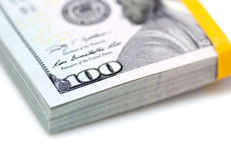 Pack  bundle  of new dollars close up on white backgroundの写真素材
