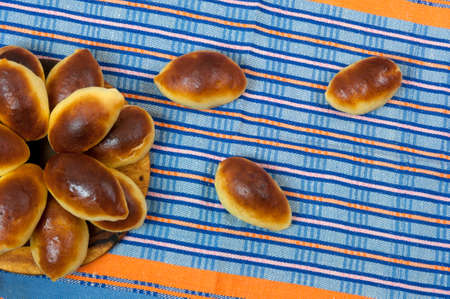 Homemade pastries (patties) on towelの写真素材