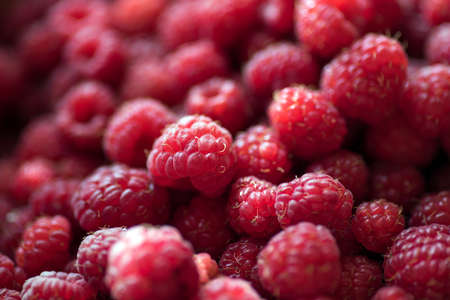 Organic ripe raspberries in basket close upの写真素材