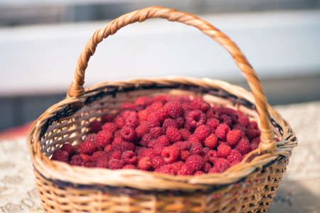Organic ripe raspberries in basket close upの写真素材