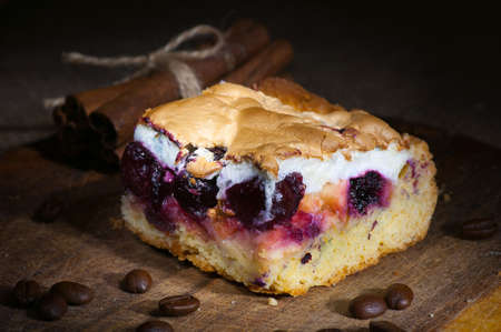 Homemade cake with whipped egg whites and cherry jam light brushの写真素材