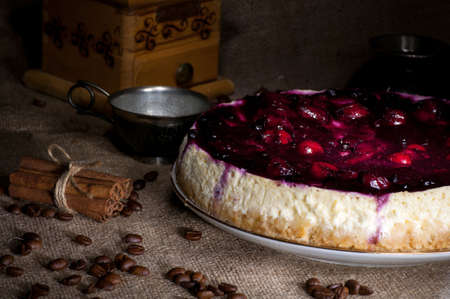 Homemade cheesecake with cherry jam light brushの写真素材