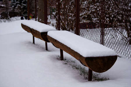 Snowy benchesの写真素材