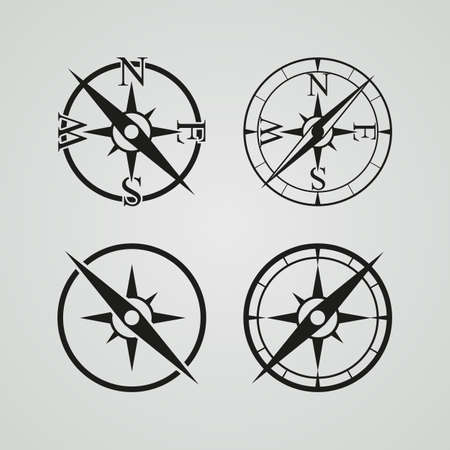 Vector icons depicting four different compasses on a color buttonsのイラスト素材