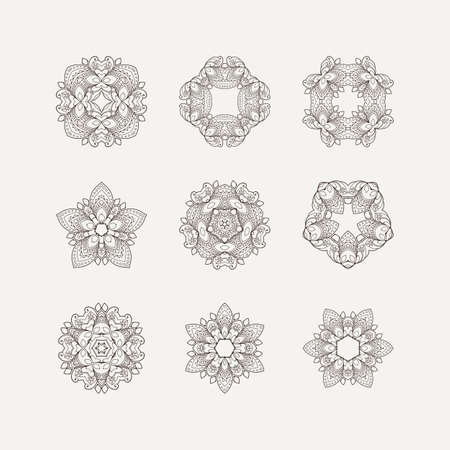 Set of ornate vector mandala symbols. Mehndi lace tattoo. Oriental weave. The circular pattern.のイラスト素材