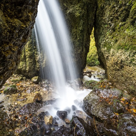 Beautiful waterfall in a narrow gorge.