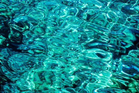 Blue azur liquid water surface. Abstract background