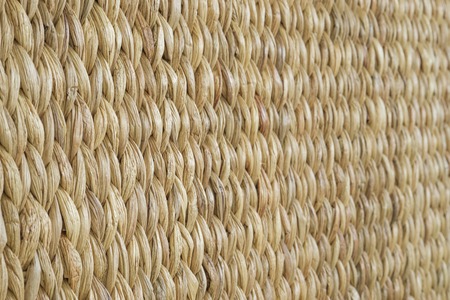 Meshwork of wooden reed wicker texture background. Oblique viewの写真素材