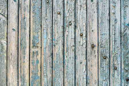 Old wood planks with paint peeling off.の写真素材