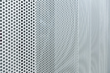 Gray metal background, round perforated metal texture