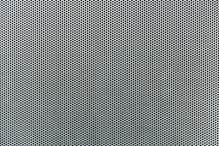 Gray metallic background with perforation of round holesの写真素材