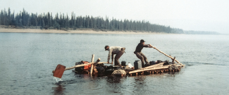 Two men rowing on self-made timber raft. Vintage expedition. Alaska.の写真素材