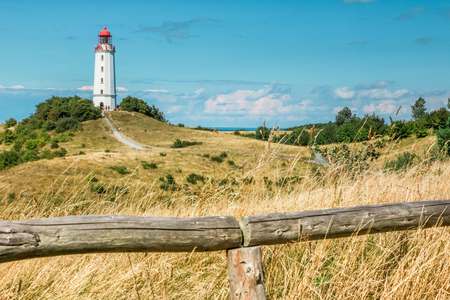 Old lighthouse Dornbusch on sunny summer day. Hiddensee, Baltic Sea.の写真素材