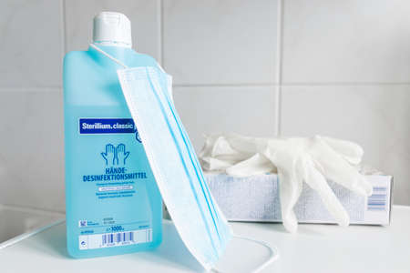GERMANY - MARCH 22, 2020: Corona Virus protection at home. Face Mask, gloves and handsanitizer for clean and hygienic breath and hands against coronavirus epidemic.のeditorial素材