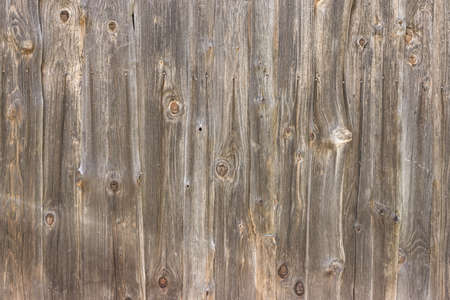 Natural brown barn wood wall. Wall texture background pattern. Wood planks, boards are old with a beautiful rustic look, style.の写真素材