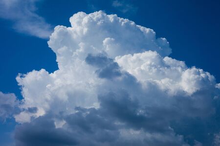 huge white cloud in the blue skyの写真素材
